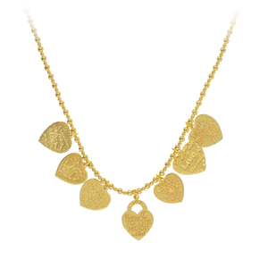 A gold-plated silver necklace featuring a series of heart-shaped pendants and smaller bead-like elements, strung on a fine gold chain.