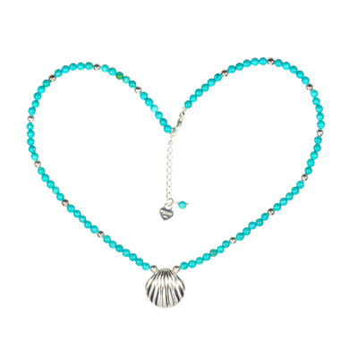 Turquoise beaded necklace with a silver shell pendant on a white background