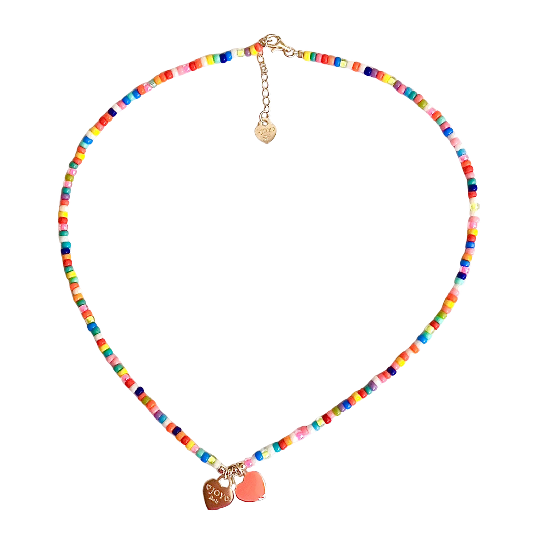 Colorful beaded necklace with heart-shaped charms on a white background