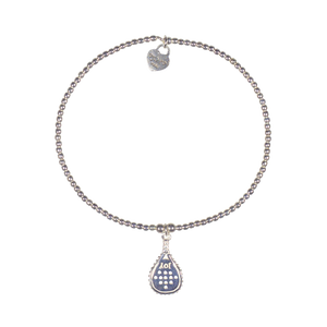 A sterling silver bracelet featuring a small padel racket charm and 2mm beads strung on elastic, with a signature logo at the clasp.